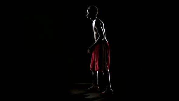 Man Play Basketball Isolated on Black