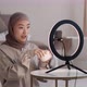 Young Muslim Asian Woman Blogger Recording Video About New Pampering Cream Telling About Smell and - VideoHive Item for Sale