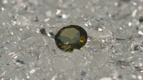 A Green Diamond On A Pile Of White Diamonds. alt
