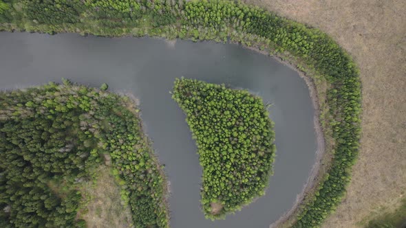 Top View of a River in a Forest in Eastern Europe