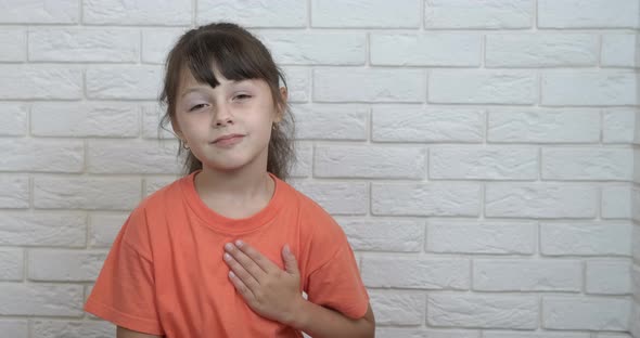 Girl Folded Hands on Heart Chest alt