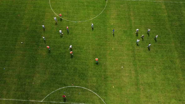 Aerial View From Top To Bottom On A Green Soccer Field.