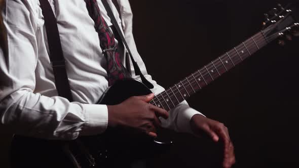 Happy Smiling African American Young Man in Stylish Suit Plays Electric Guitar and Sings a Song alt