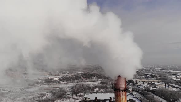 A Pipe with White Puffs of Smoke alt