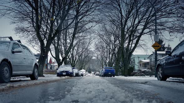 Moving Over Icy Road In Residential Area alt