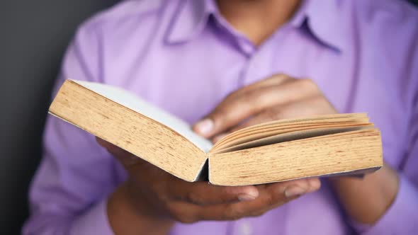 Close Up of Man's Hand Turning a Pager of a Diary alt