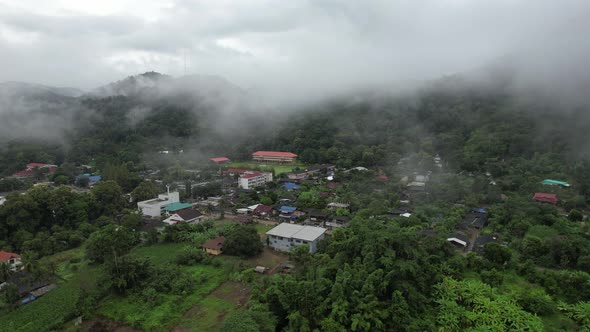 Aerial view of rural village in valley, Chiang Mai, Thailand by drone