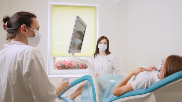 Competent Female Gynecologist in Uniform and Mask Holding Sterile Tools for alt