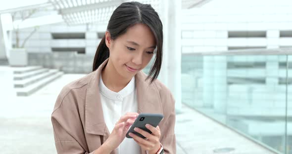 Business woman use of mobile phone alt