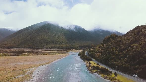 Drone Flyover of the Lewis Pass and Boyle River in New Zealand - Dolly Shot alt