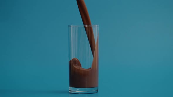 Super Slow Motion of Pouring Chocolate Milk in Glass at 1000 Fps alt