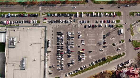 Aerial Drone View Top Down View of Supermarket Parking Lot with a Lots of Cars alt