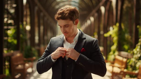 Smiling Man Looking at Camera in Park. Groom Preparing for Wedding Ceremony alt