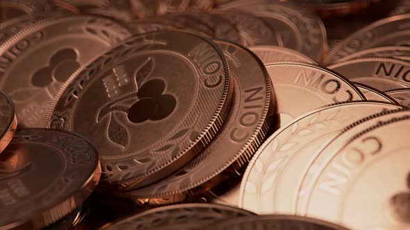 A big pile of generic, fake coins in copper colour. Seamlessly looping shot. alt