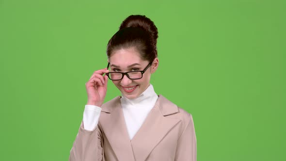 Elegant Woman Flirts and Builds Eyes To the Guys. Green Screen. Slow Motion alt