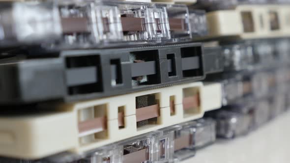 Lot of anlaog magnetic tapes 4K 2160p 30fps UltraHD tilting  footage - Archived retro compact  audio alt