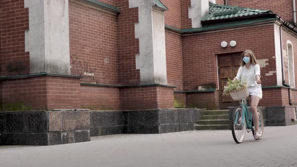 Girl in a Mask on a Bicycle alt