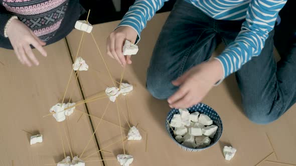 Children setting up construction during a science lesson alt