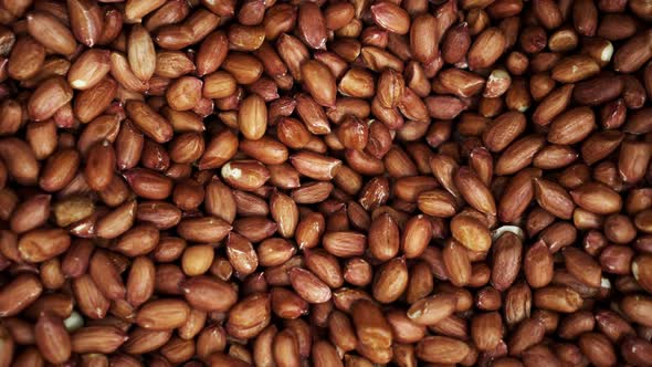Many Mixted of Red Nuts Close Up Rotating on the Background in a  Store alt