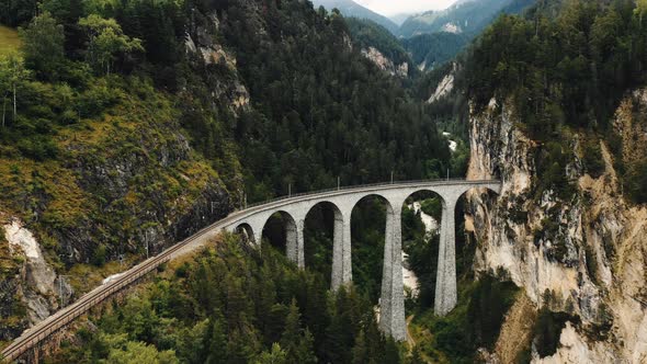 Drone Flying Above Famous Landwasser Viaduct Bridge, World Heritage Destination in Summer Graubunden alt