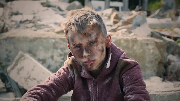 Teenager Sitting Near Ruined Building alt