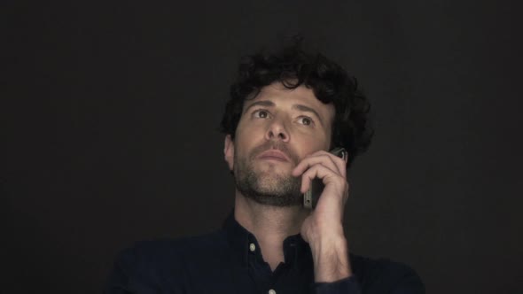 Man using cell phone to make a phone call alt