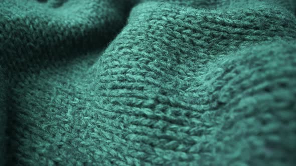 Extreme detail view of sheep wool cloth texture flowing in macro dolly shot. alt