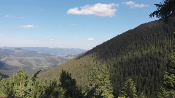 Meditation and Relaxation in the Mountains. Girl on a Mountain Peak. Unity with Nature. Mountains