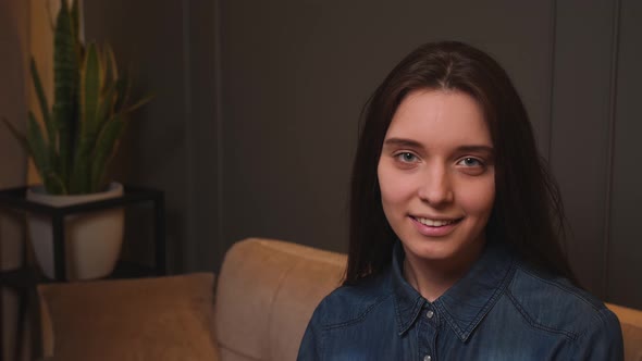 Confident Smiling Young Woman Looking at Camera Standing at Home Office alt