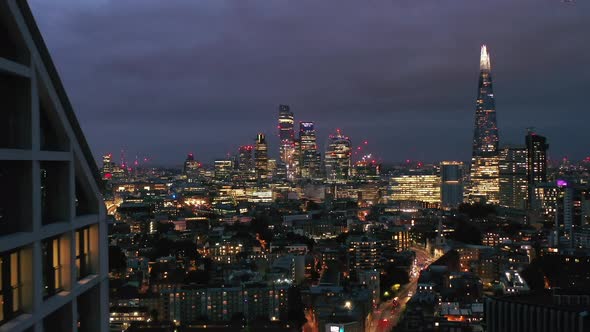 Panoramic Aerial View of Illuminated Downtown Skyscrapers at Night alt