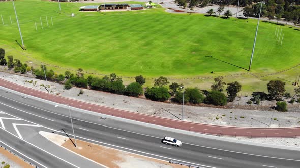 Aerial View of a Busy Freeway near an Oval in Australia