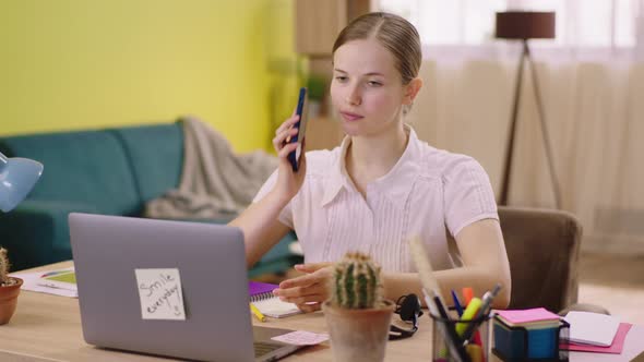 Call Centre Agent Working From Home at Her Laptop