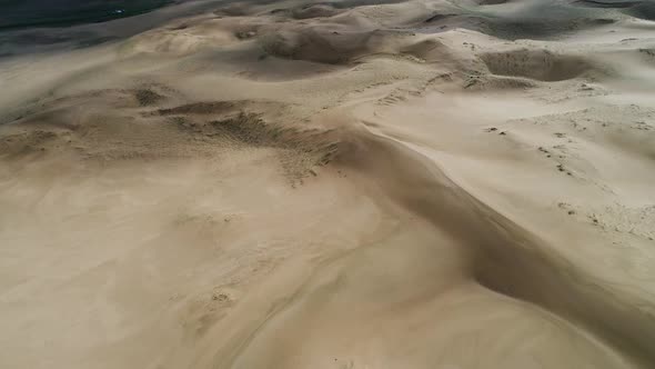 Flight over the barkhans in the desert.