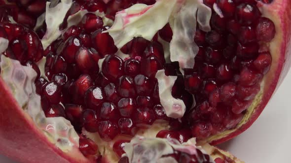 Peeled pomegranate, juicy berries Punica granatum. Pomegranate seed