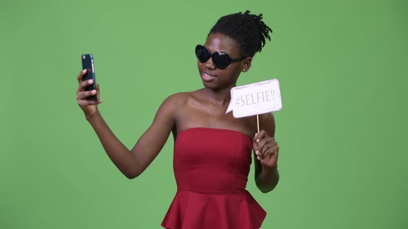 Young Beautiful African Woman Taking Selfie