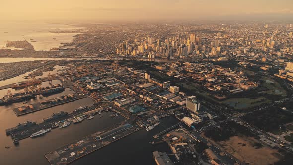 Sunrise at Pier of Metropolis City at Sea Bay Aerial alt