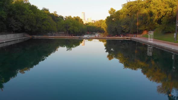Straight shot of barton springs pool over to barking springs spillway towards downtown Austin Texas. alt