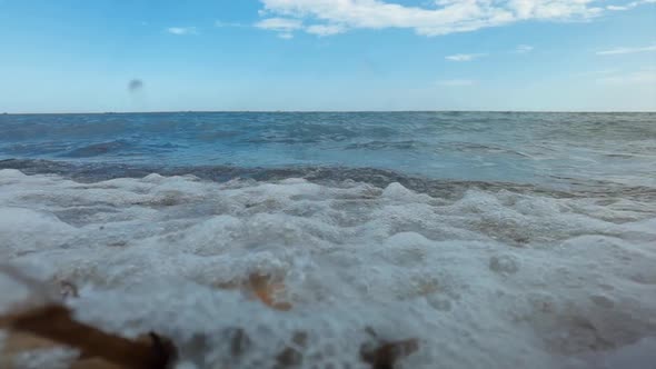 Slow Motion Footage of Waves Breaking on Pebble Beach alt