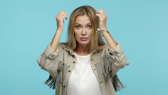 Slow Motion of Frustrated Blond Woman Showing Head Explosion Gesture Blowing Head and Staring
