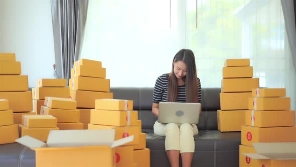 Woman with packing box ready for shipping alt