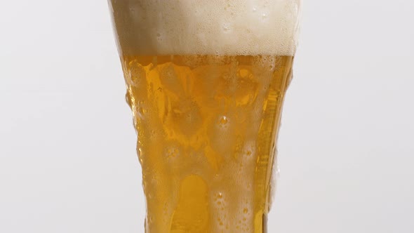 A Glass of Beer With a Foam