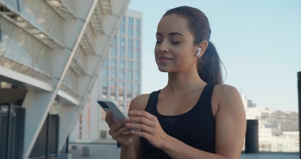 Fit Woman Runner Making Selfie Photos on Her Smartphone After Sport Fitness Training Outdoors Near alt