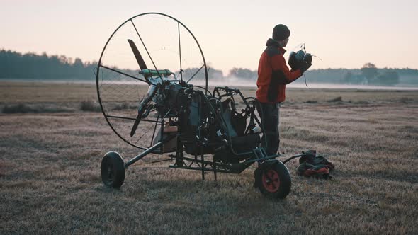 Man Checking and Preparing Safety Gear for Customer alt