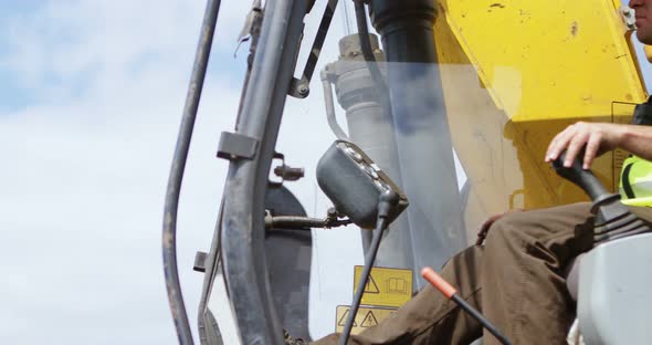 Male Worker Operating Excavator Machine 4k alt