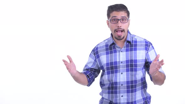 Happy Bearded Persian Hipster Man Snapping Fingers and Looking Surprised alt