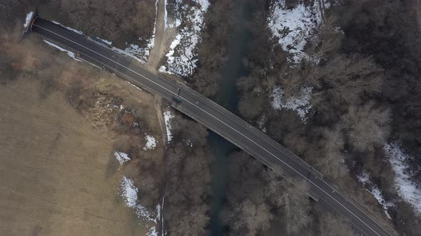 Traffic over the river bridge 4K aerial video