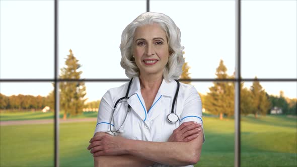 Portrait of Happy Female Doctor Looking at Camera. alt