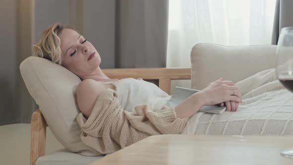 Young Woman Napping in Hotel Room at Daytime alt