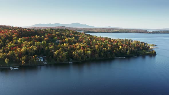 Aerial Blue Still Water in Autumn Forest Lake with Foliage Trees Moosehead Lake alt