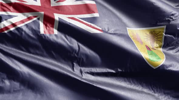 Turks and Caicos Islands textile flag waving on the wind. Slow motion. 20 seconds loop.  alt